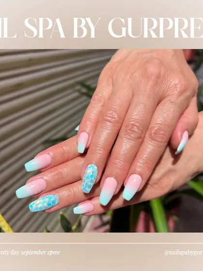 This design combines a soft pink-to-blue ombré with accent nails featuring holographic mermaid-scale glitter. It’s a dreamy and whimsical look that’s perfect for a vacation or a summer party.