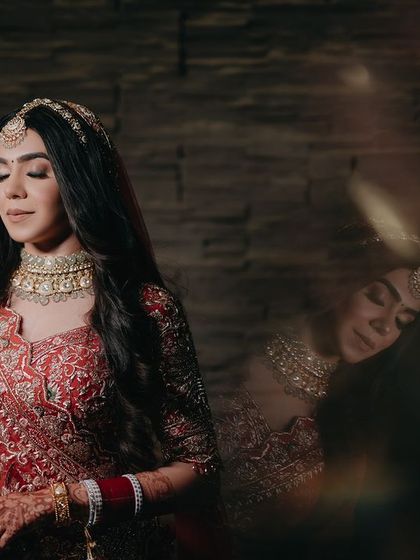 An artistic portrait of Nandika with a reflection effect. This creative technique adds a dreamy and ethereal quality to the image, highlighting her beauty in a unique way.