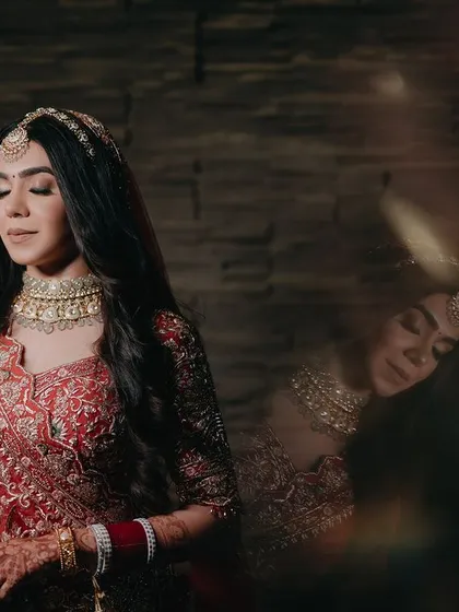 An artistic portrait of Nandika with a reflection effect. This creative technique adds a dreamy and ethereal quality to the image, highlighting her beauty in a unique way.