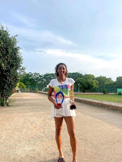 A moment of joy and accomplishment. Yashi celebrates her double crown victory, a testament to her exceptional performance and the support of the PBI coaching team.