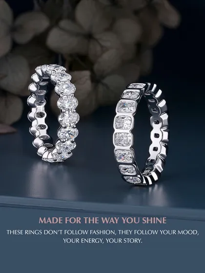 These rings do not follow fashion; they follow your story. This image showcases two of my custom diamond eternity bands, one with oval-cut diamonds and the other with emerald-cut diamonds. Each band is made for the way you shine, reflecting your energy and mood.
