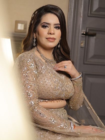 A portrait of my bride in her stunning sequined lehenga. The makeup is glamorous with a smokey eye and nude lips to balance the bling.