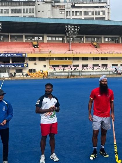 Standing on the turf with Indian hockey players Jarmanpreet Singh and Nithin Thimmaiah. We are committed to connecting our athletes with the best in the sport.