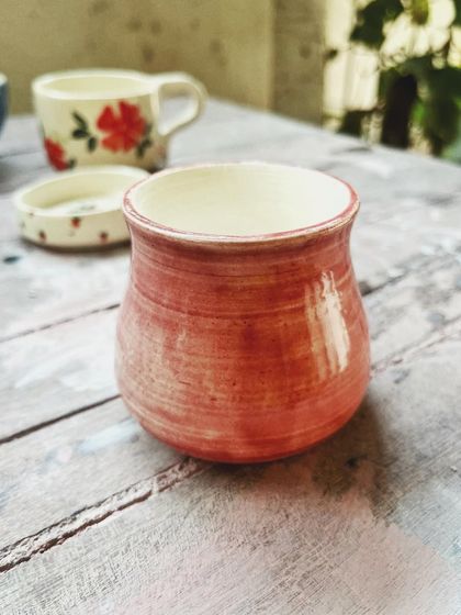 Look at the beautiful creations from this student who completed the intense potter's wheel course. Each piece is a masterpiece, adorned with colorful glazes and intricate, hand-painted details.