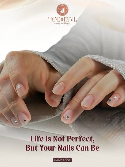 Even simple nail art can make a big impact. This minimalist design features a natural base with delicate dots and strategically placed rhinestones for a touch of sparkle.