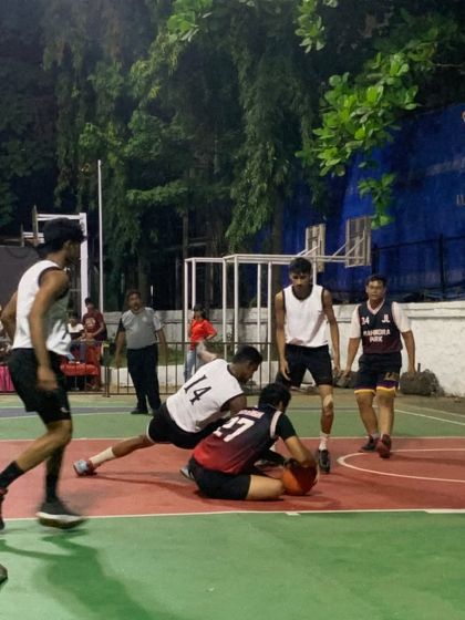 A scramble for a loose ball shows the grit and determination we instill in our players. We teach them to fight for every possession.