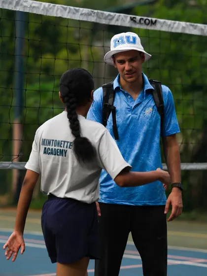 A handshake of respect and encouragement. Building a player's confidence is as important as building their skills.