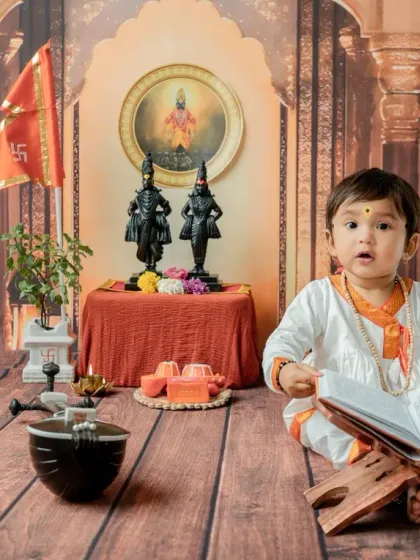 A 'Chota Varkari' engrossed in a holy book. This pose is wonderful for sitter-age babies and adds a serene, devotional feel to the traditional Varkari-themed shoot.