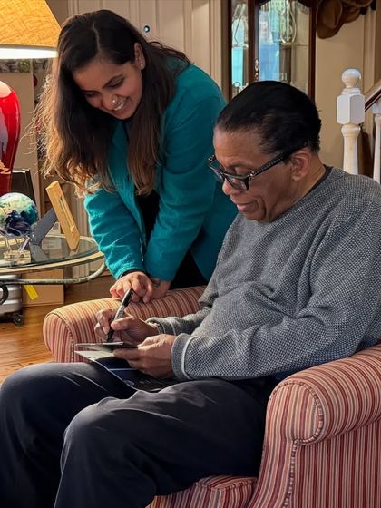 A photo of Herbie Hancock signing an autograph for me. His kindness and generosity are as immense as his musical genius.