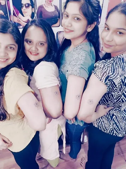 A group of friends who all got matching tattoos at my studio. Getting inked together is a great way to celebrate friendship.