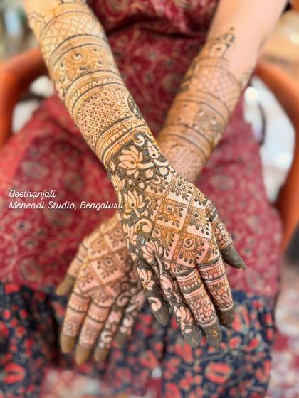 A beautiful, intricate design for a baby shower, with a mix of traditional patterns and subtle baby-themed elements.