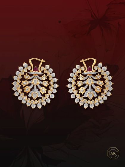 Crafted in 18k gold and adorned with rose-cut diamonds, these earrings feature a striking ruby cabochon at the top, blending regal allure with impeccable craftsmanship.