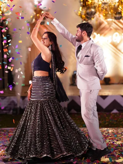 A beautiful moment from a couple's Sangeet dance, with confetti raining down. I plan these picture-perfect moments to ensure your wedding photos are as magical as the event itself.