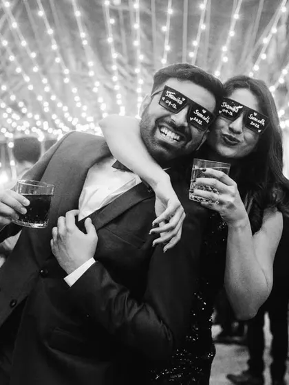 The same fun moment in black and white. It gives the cocktail party photo a classic, timeless party vibe.
