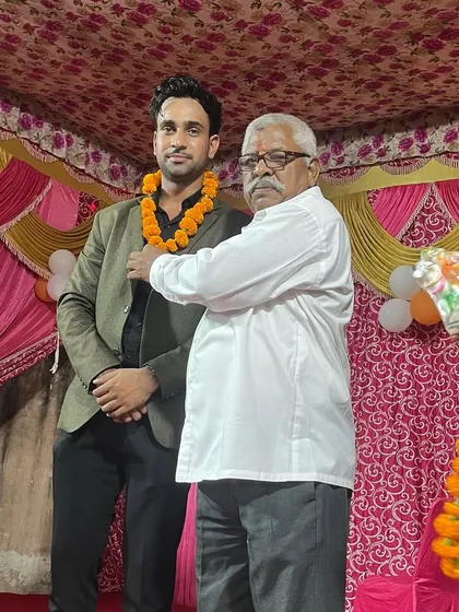 A moment of respect as I am felicitated with a garland.