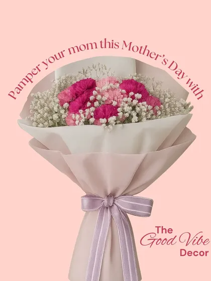 A simple and sweet bouquet perfect for Mother's Day. This arrangement features lovely pink carnations and delicate baby's breath, wrapped in soft pink paper and tied with a lavender ribbon.