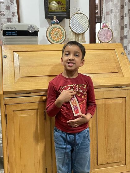 My youngest grandson proudly showing off the bookmark he made. He called it his "art," a beautiful reminder that creativity has no age limit.