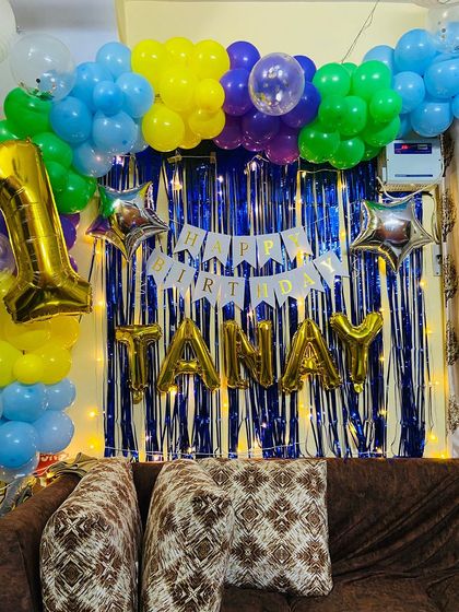 A full view of the first birthday home decoration, ready for the party to begin.