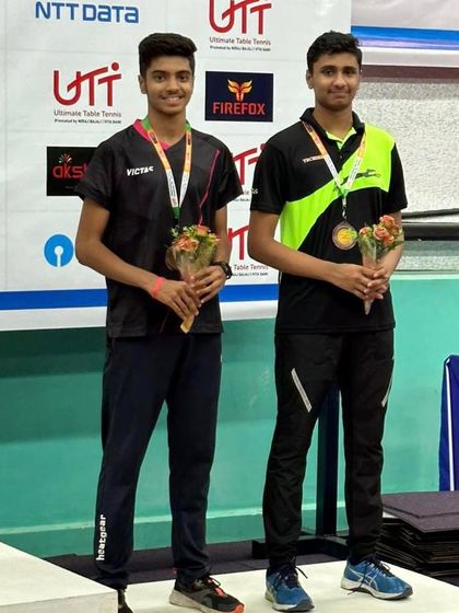 A duplicate image of the doubles partners on the podium in Hyderabad.