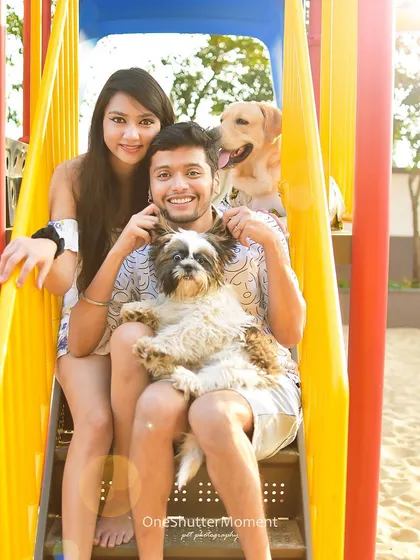 A perfect family of four enjoying a sunny day at the playground. These sessions are all about play and capturing the natural, happy interactions between you and your pets in a vibrant, fun-filled environment.