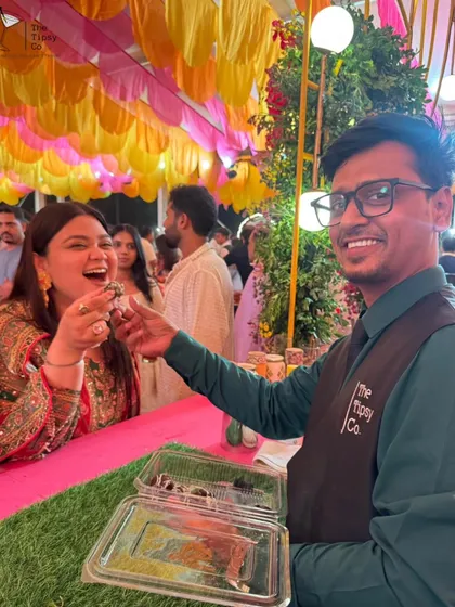 A guest enjoying one of our signature Alcoholic Chocolate Shots. These boozy, edible creations are always a hit, offering a delightful surprise that combines dessert and a drink.