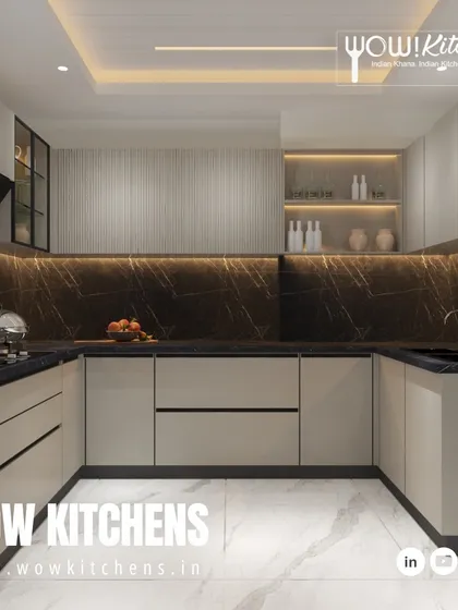 This U-shaped layout demonstrates our ability to maximize counter space and storage in any room, using a dark marble backsplash to create a continuous, luxurious feel.