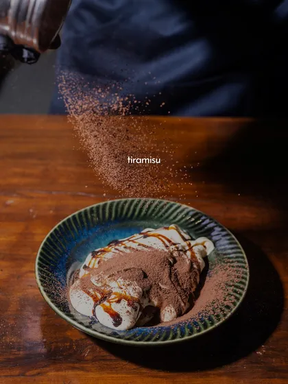 A little dusting of cocoa, a lot of indulgence. This is my take on Tiramisu, where clouds of mascarpone cream and coffee-soaked ladyfingers come together. It’s a sweet, playful ending to any meal.