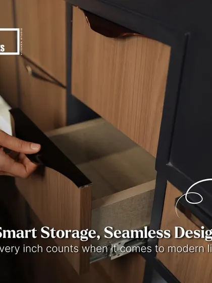 Our drawer systems are designed for modern living. This image shows a sleek, handleless drawer with a wood finish, part of a larger modular storage unit.