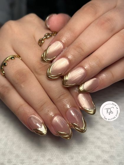 Perfect for Diwali or any festive occasion, this set features a soft cat-eye base with sculpted gold chrome borders. It’s a look that is both festive and incredibly chic.