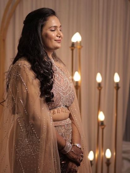 This candid shot highlights the intricate beadwork on the blouse and the soft, flowing tulle of the cape. It’s a beautiful example of the detailed craftsmanship available in my rental collection.