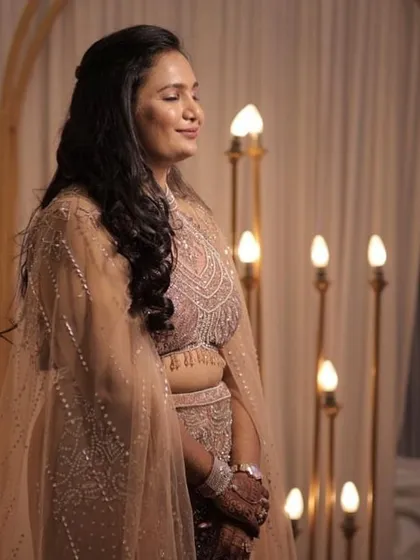 This candid shot highlights the intricate beadwork on the blouse and the soft, flowing tulle of the cape. It’s a beautiful example of the detailed craftsmanship available in my rental collection.