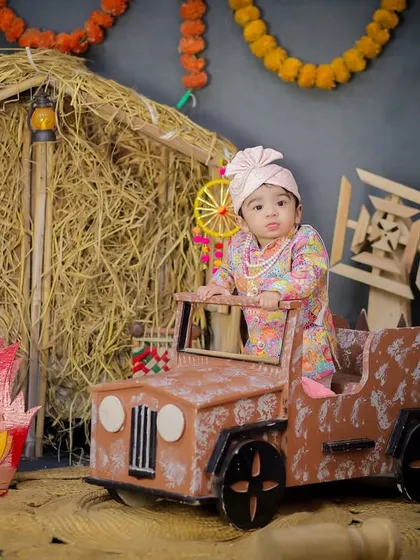 This baby is ready to drive into the Lohri celebrations. A fun shot in the mini jeep that adds a playful element to the traditional theme.