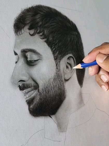 Here, I'm using a fine-tipped pencil to add highlights to the groom's ear and beard, adding another layer of realism.