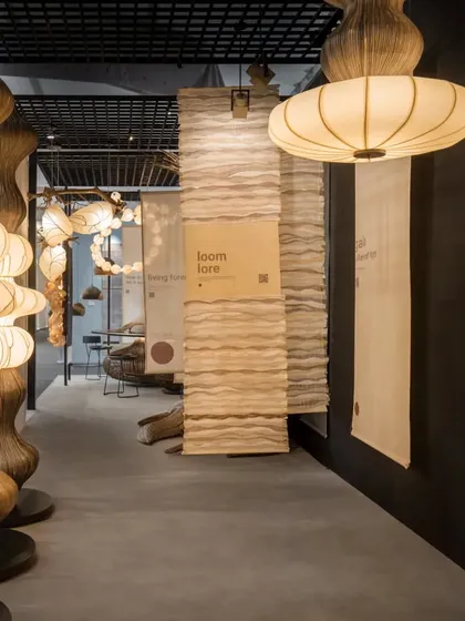This was the entrance to the Oorjaa booth we designed at India Design. We used simple, hanging kora fabric panels to create pathways and demarcate different zones. The design guides visitors through the space, allowing the sculptural lighting to be the main focus while creating an intuitive and calming experience.