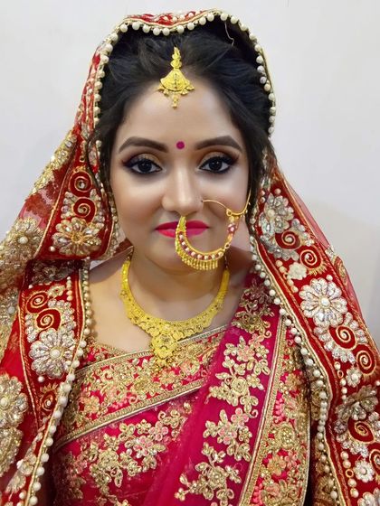 The stunning 'after'. A classic bridal look with beautifully defined eyes, a traditional nose ring (nath), and a look of pure confidence.