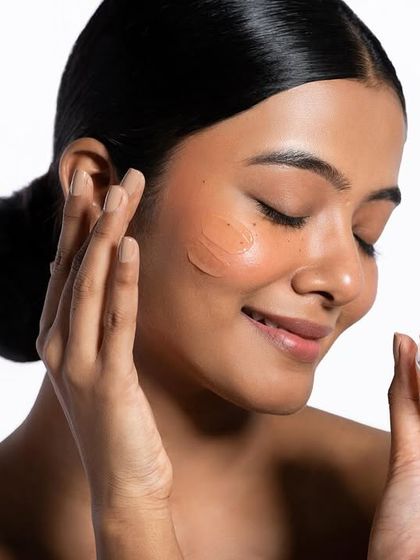 Capturing the ritual of skincare application. This image shows the product being gently applied, highlighting its smooth texture and the sensory experience. It’s an effective way to communicate the luxurious feel of a skincare item.