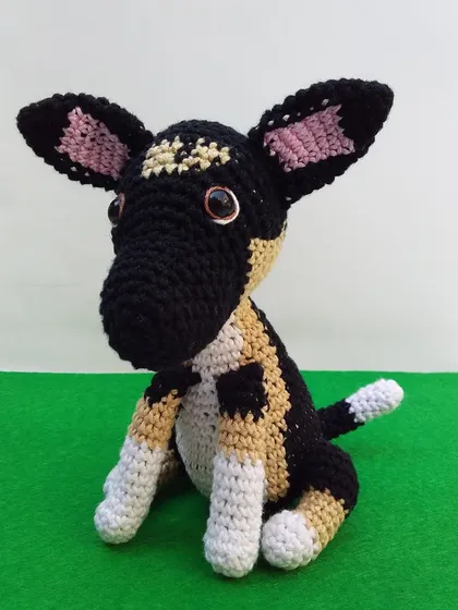 Another angle of the handmade dog toy, highlighting its big ears and sweet expression. I try my best to capture the personality of each pet from the photos I receive.