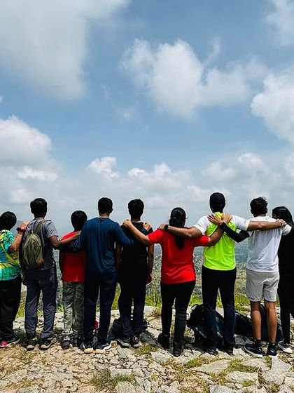 Standing together, looking out at the world. This is more than just a group photo. It's a snapshot of shared accomplishment, new friendships, and the kind of view that connects you to nature and to each other.