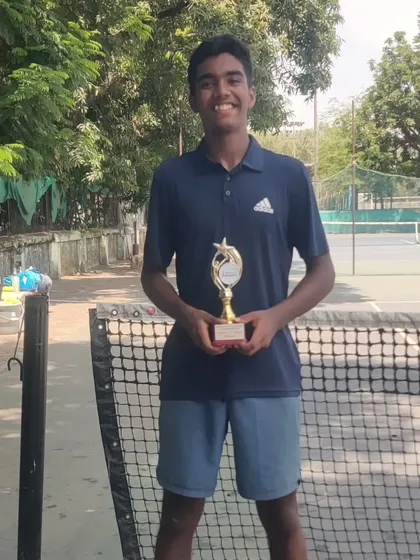A champion's pose. Keshav Nahata with his winner's trophy from the Maharashtra State U-17 Championship.