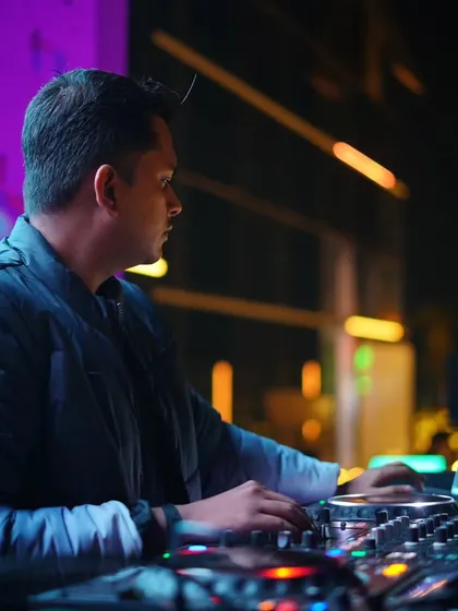 In my element, selecting the next track for a rooftop gig. The purpose of my life is to make people happy through music.