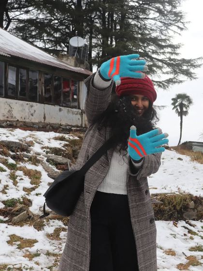 A fun, snowy family trip to Lal Tibba. I styled myself in a warm checkered long coat, a cozy beanie, and bright gloves for a pop of color against the white snow.