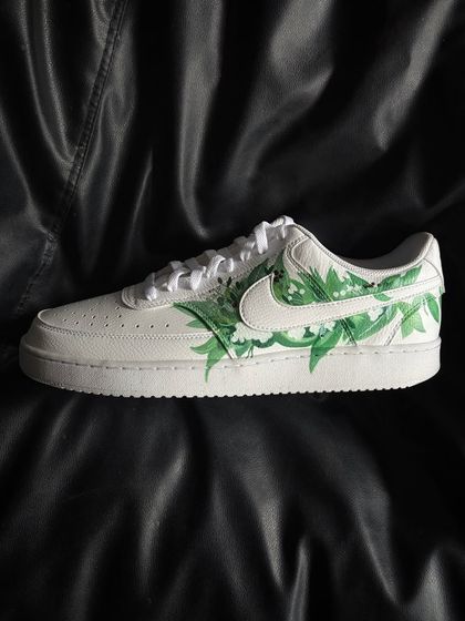 A side profile of the white floral custom sneaker.
