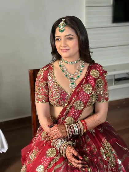 Seated portrait of my bride, looking ethereal and elegant. The makeup is designed to last through all the moments of her special day without feeling heavy.
