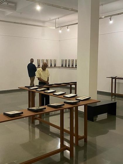 A wider view of the installation, showing how the repeated forms create a powerful visual rhythm in the gallery space.