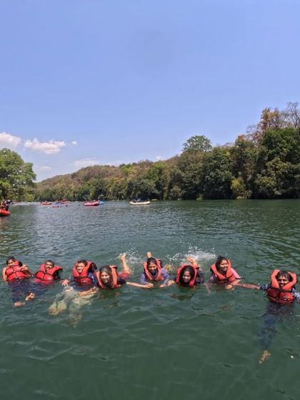 A group of friends floating and having fun in the river. It's a relaxing part of our adventure trip.