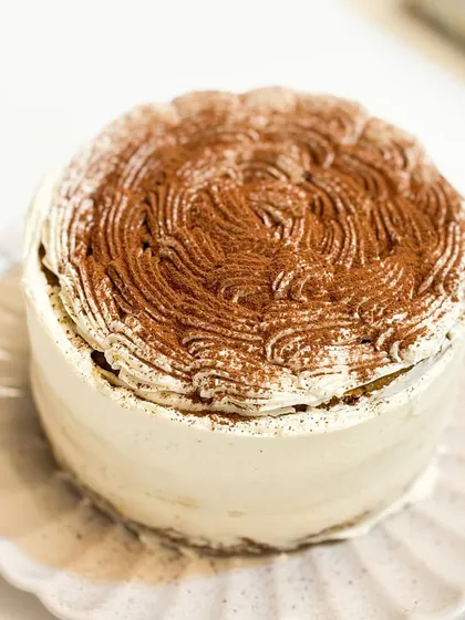 Lost in a world of gluten-free Tiramisu bliss. This cake is made with almond flour and is a coffee lover's dream, without any gluten.