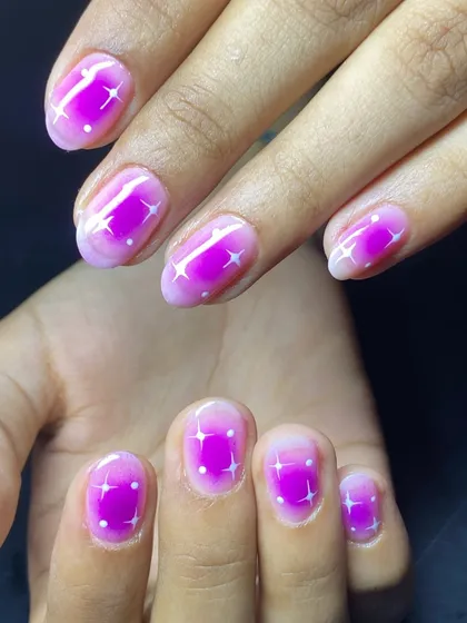 Another look at the trendy and eye-catching magenta aura nails.