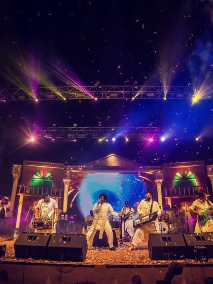 On stage at the Rajdanga Pithe Puli Utsav, surrounded by confetti and cheers. This stage feels like home, and we are always grateful for the love we receive here.