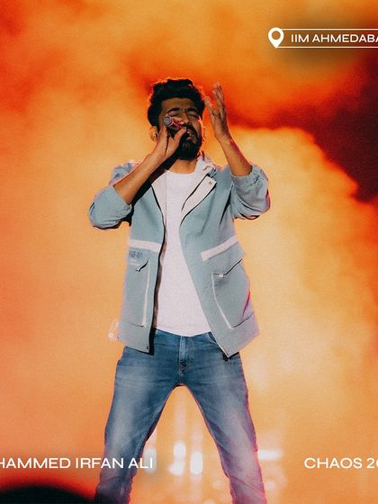 Mohammed Irfan Ali against a backdrop of fiery orange smoke at Chaos 2024.