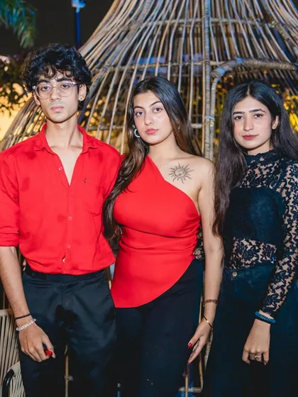 A group of stylishly dressed guests.